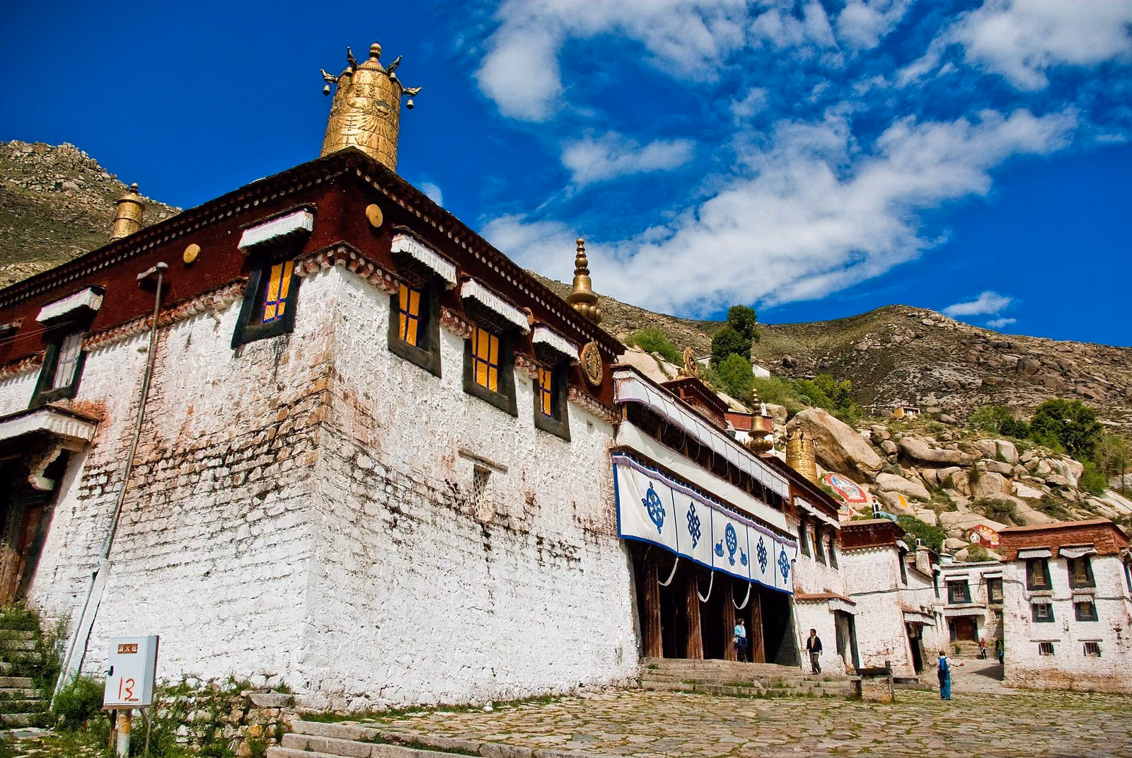 White monastery walls and gilded roof ornaments at Sera Monastery near Lhasa