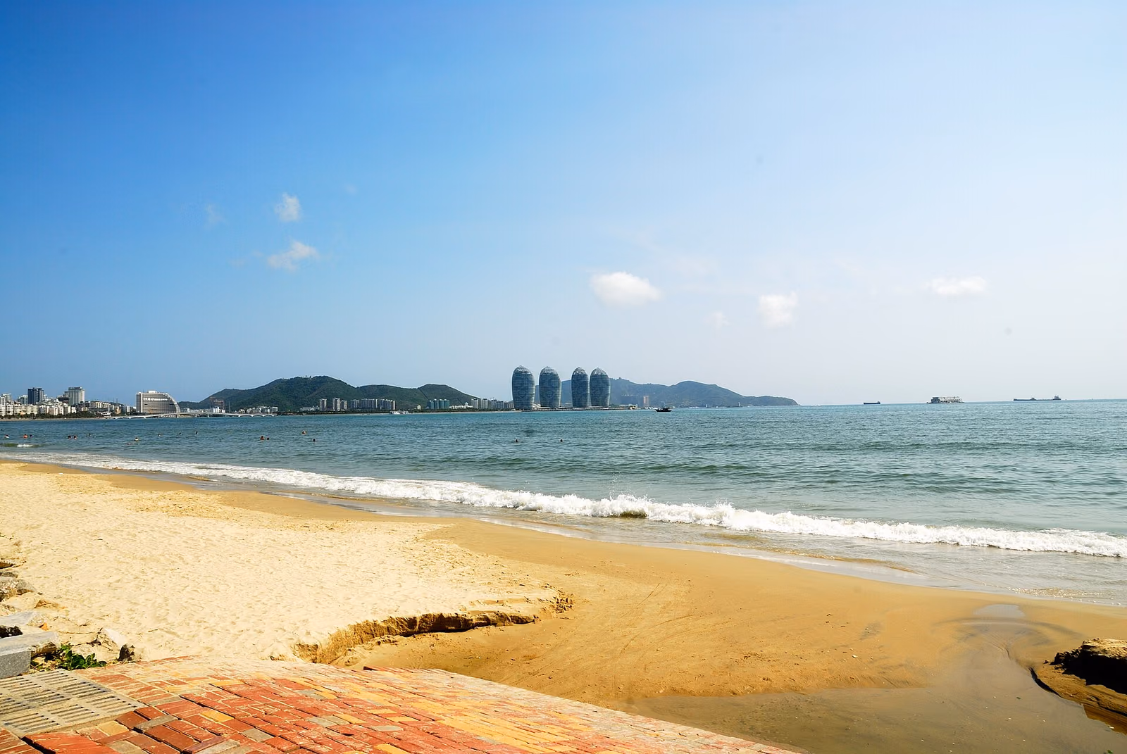 Palm-lined sand and sea at Sanya Bay