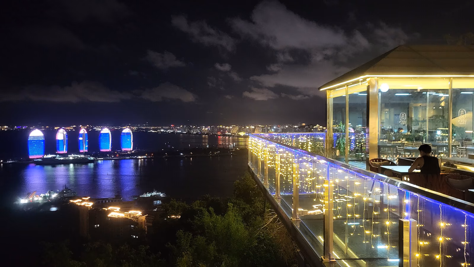 Sanya's illuminated bays viewed from Luhuitou Park at night