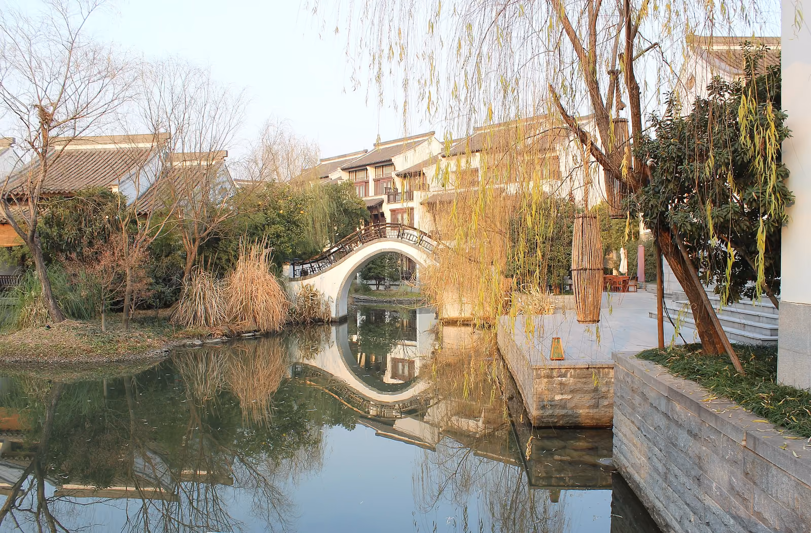 Arched bridge and waterside pavilions at Banyan Tree Hangzhou