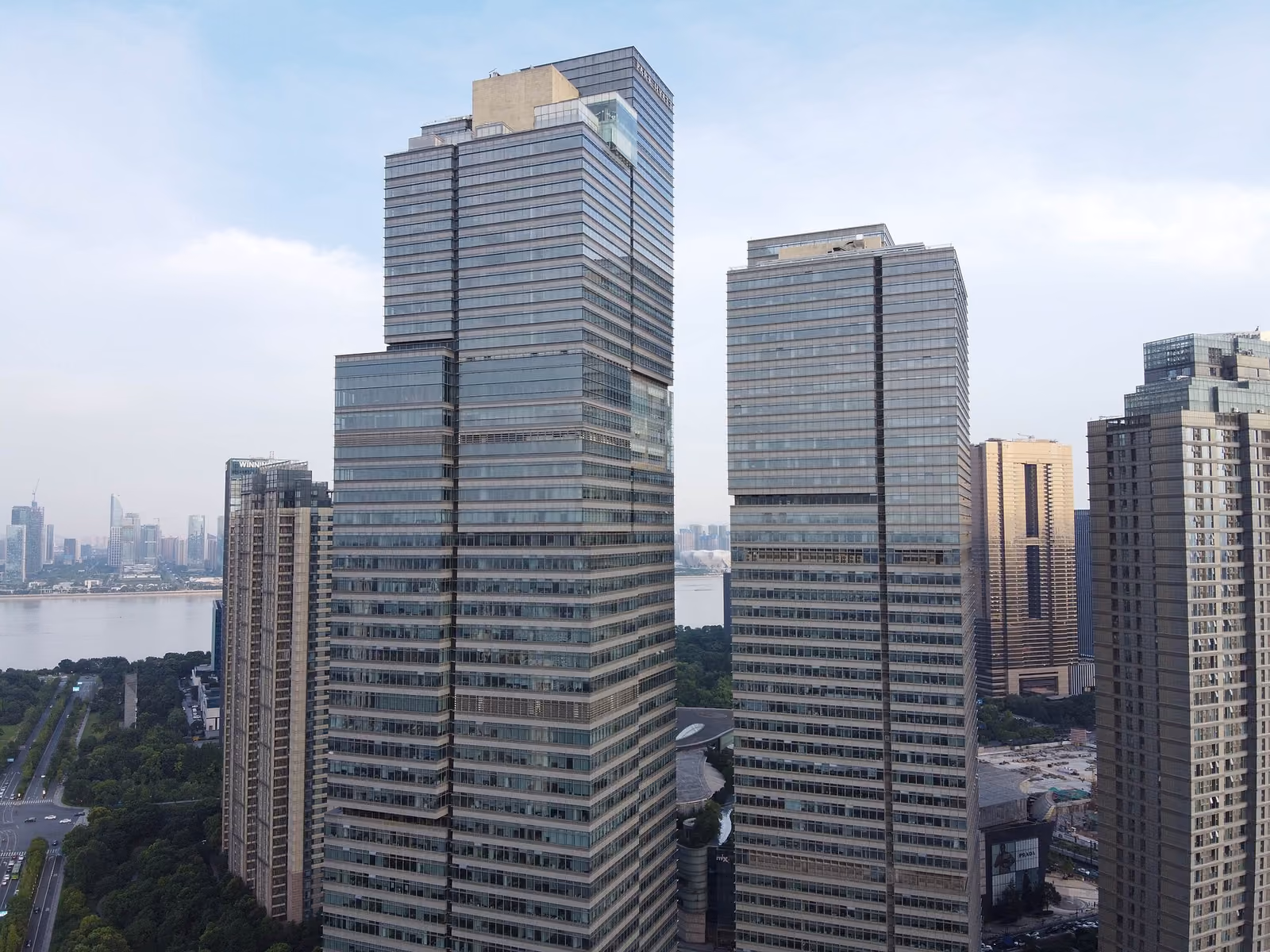 Park Hyatt Hangzhou occupies the upper floors of the stepped tower on the left, photographed in 2020