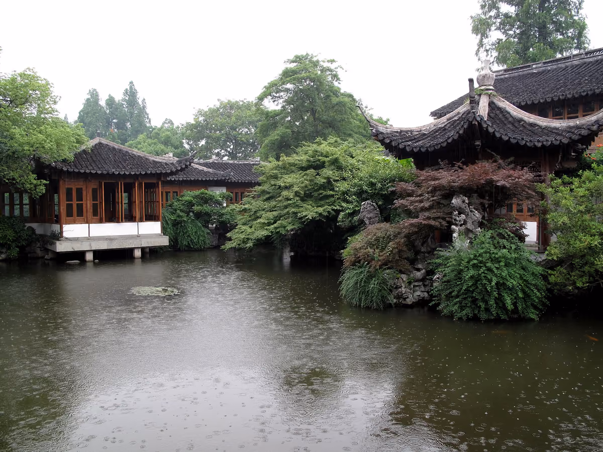 Garden pavilions reflected in the pond at Guo’s Villa beside West Lake, Hangzhou