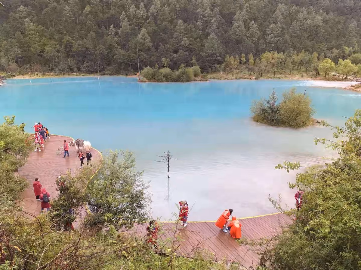 Blue water and the lakeside boardwalk at Blue Moon Valley, Lijiang