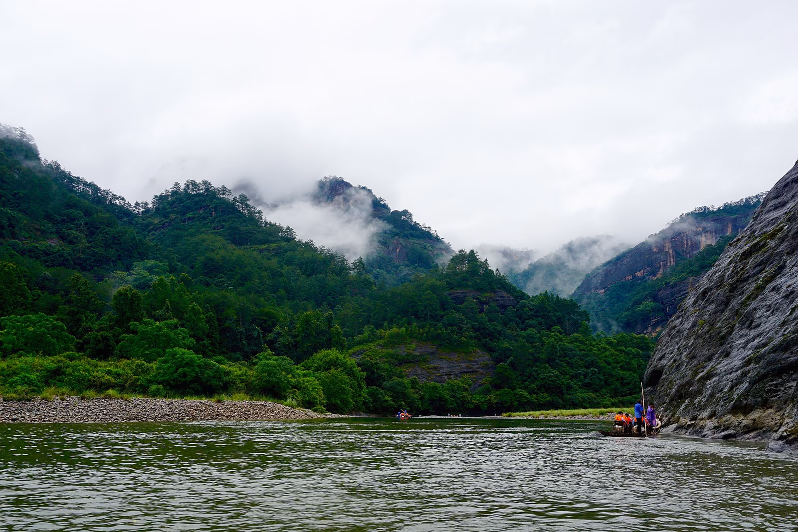 The river winding below forested sandstone peaks in Wuyishan